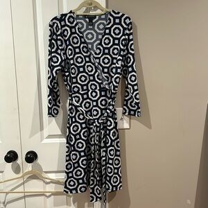 Navy blue, geometric pattern wrap style dress.